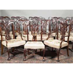 A SET OF TWELVE MAHOGANY CHIPPENDALE REVIVAL DINING CHAIRS, INCLUDING TWO OPEN ARMCHAIRS, 19th...