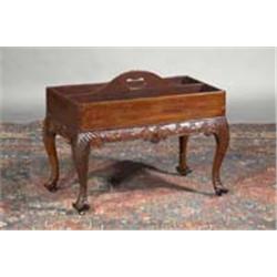 A MAHOGANY BOTTLE CARRIER, IRISH, 18th CENTURY, the reeded tray top with central arched divide...
