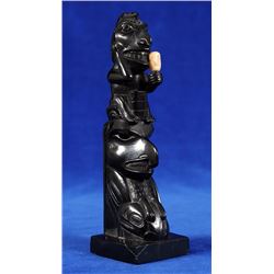 Haida Argillite Shaman Holding a Rattle and an Eagle with a Salmon ca. 1900  7" H. 2 1/8" W.  Good C