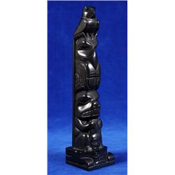 Tom Hans Argillite Totem Carved with Eagle, Raven and Beaver with Human Face on a Frog Base 9 3/8" H