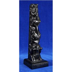 Claude Davidson Argillite Totem Carved with Raven Holding a Frog, Bear and Beaver 11" H. 3 1/2" W. B