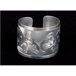 Northwest Coast White Metal Bracelet with Incised Raven Design 7" L. 2" W.  Good Condition