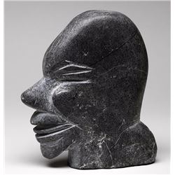 Carving of an Inuk Head by Lucy A. 7 1/2" H. 6 1/2" L.  Good Condition