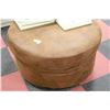 Image 1 : RUSTIC LOOKING  ROUND MICROFIBER OTTOMAN