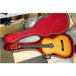 GUITAR IN BLACK CASE