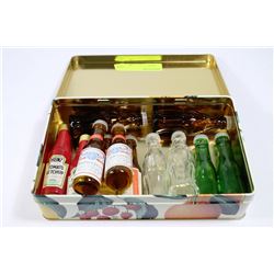 TIN OF COLLECTOR MINI BOTTLES SALT AND PEPPER SHAKERS
