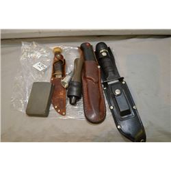 Bag Lot : Three Knives w/scabbard - duck call - sharpening stone - collectible Auer Bullet Lighter (