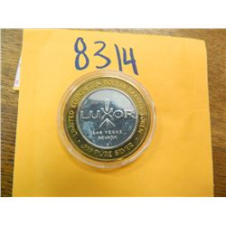 .999 Fine silver casino $10 token/strike ASW= .60 oz.
