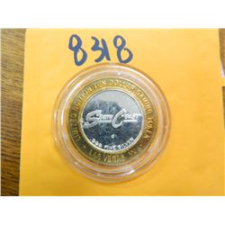 .999 Fine silver casino $10 token/strike ASW= .60 oz.