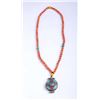 One silver Tibetan talisman strung in rare salmon  coral beads 11mm in diameter and 32 inches long  