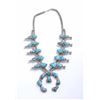 Image 1 : Silver squash blossom necklace with large  turquoise nuggets, approximately 16” hanging  length; fin