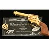Image 2 : Western Ranger Plains Rider SA Revolver, .22  caliber, 4 ¾” barrel, wood grips, gold finish, S/N  rr