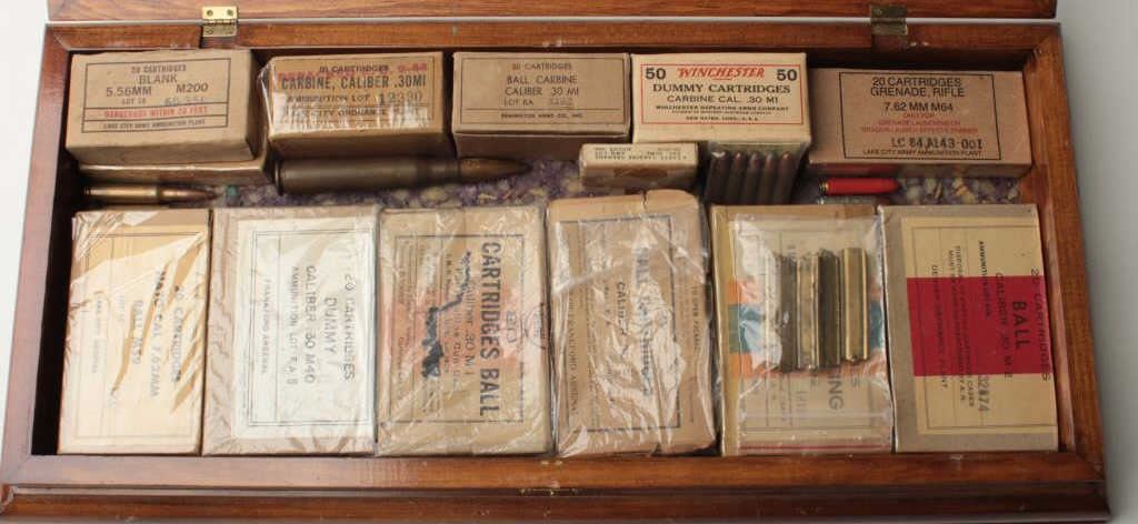 Display Military Rounds Beautiful wood and glass ammo display case with 13 boxes of misc. U.S ...