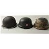 Image 2 : Lot of 3 military helmets including a good  reproduction of an SS helmet, possibly a movie  prop; a 