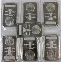 COLLECTION OF SEVEN 1 TROY OUNCE FINE  SILVER BARS