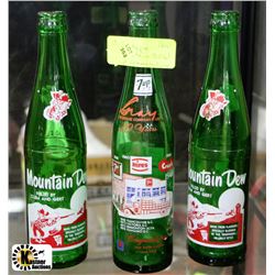 3 VINTAGE MOUNTAIN DEW AND 7-UP BOTTLES