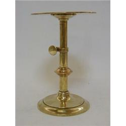 A BRASS CANDLE STAND, 19th Century, circular base  30-40...