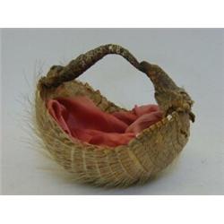 AN EDWARDIAN SEWING BASKET  formed from an Armadillo, silk lining, width 18cm  20-30...
