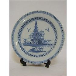A TIN GLAZED EARTHENWARE PLATE, second half of the 18th century, undeglaze blue pine tree scene,...