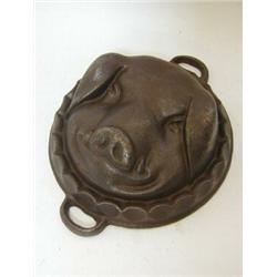 A CAST IRON BRAWN MOULD, farmed as a boars mask, diameter 24cm  20-30...