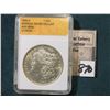 Image 1 : 1885 O Morgan Silver Dollar in a "NPG MS 65" holder, although I would question their grading.