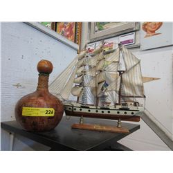 Ship model & wine bottle
