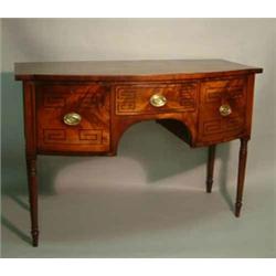 A Regency mahogany bow-fronted sideboard, fitted centre drawer, flanked by a cellaret drawer and...