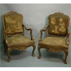 A pair of Louis XV style giltwood open armchairs, carved throughout with acanthus leaf scrolls, o...