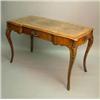 Image 1 : A Victorian inlaid figured walnut writing table, with leather skiver over a frieze drawer on cabr...