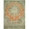 Image 1 : A Tabriz Persian carpet, circa 1900, the soft rust field with a pale brown and ivory lobed medall...