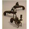 Image 1 : Two 19th Century iron tinderlocks, with wooden handles decorated with silver masks and a brass ti...
