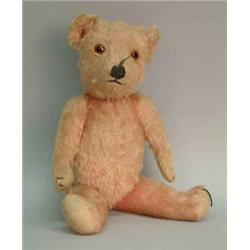 A Chad Valley pink plush teddy bear, circa 1939....