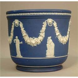 A large Wedgwood blue jasper jardiniere, modelled with a continuous design of classical figures a...