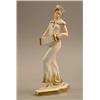 Image 1 : A Royal Dux art deco figure of a lady playing a concertina. 11.5ins...