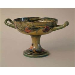 A Moorcroft Spanish pattern 2-handled comport on circular foot, green script signature and dated...