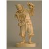 Image 1 : A Japanese carved ivory figure of a fruit picker, startled by a lizard, signed 5ins...