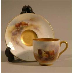 A Royal Worcester coffee cup and saucer, painted by Harry Stinton with Highland cattle, 1911....