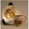 Image 1 : A Royal Worcester coffee cup and saucer, painted by Harry Stinton with Highland cattle, 1911....