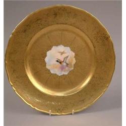 A Royal Worcester cabinet plate painted with 'Wild Duck' by D. Whatmore, reserved against a toole...