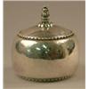 Image 1 : A George Jensen oval box and cover with lightly hammered body and floral knop, 1920 and numbered...