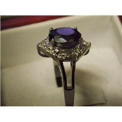 RING - 1.5 CT OVAL FACETTED LOLITE WITH 4 SHOULDER DIAMONDS IN STERLING SILVER SETTING - INCLUDES CE