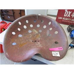 Vintage metal tractor seat