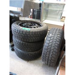 4 Used studded tires on rims