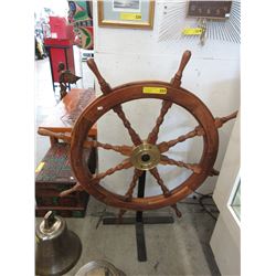 Wood ship's wheel on stand