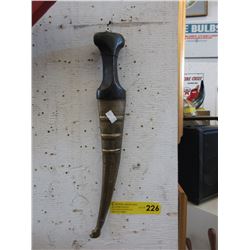 Knife in a brass plated sheath