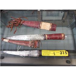 2 Daggers with leather sheaths