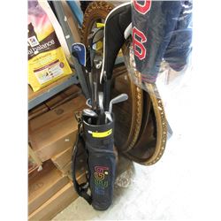 Assorted golf clubs in bag- used