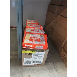 12 Packages of Huggies baby diapers