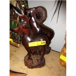 2 Solid carved wood statues