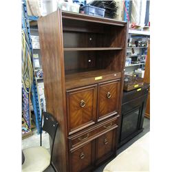 Entertainment cabinet with pullout shelf